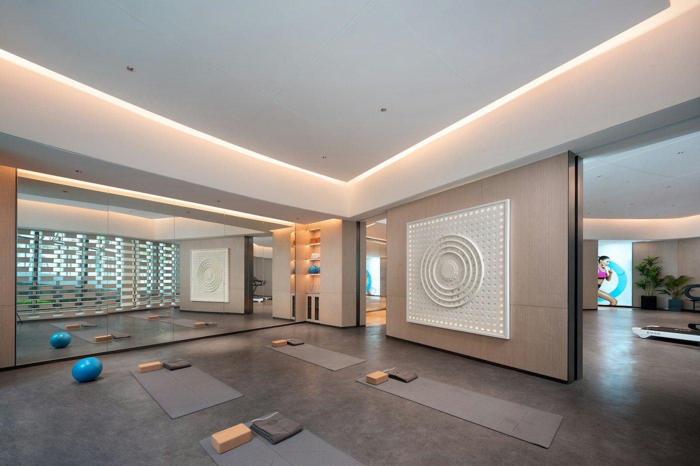 Modern yoga studio with exercise mats laid out across the floor
